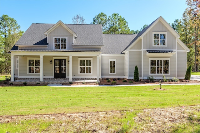 view of front of house featuring a front yard and covered porch