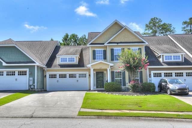 109 Mitchell Dr, North Augusta, SC 29860 - view of front facade with a front lawn, concrete driveway, an attached garage, and roof with shingles