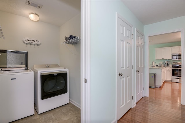 109 Mitchell Dr, North Augusta, SC 29860 - laundry room featuring washer and clothes dryer and baseboards
