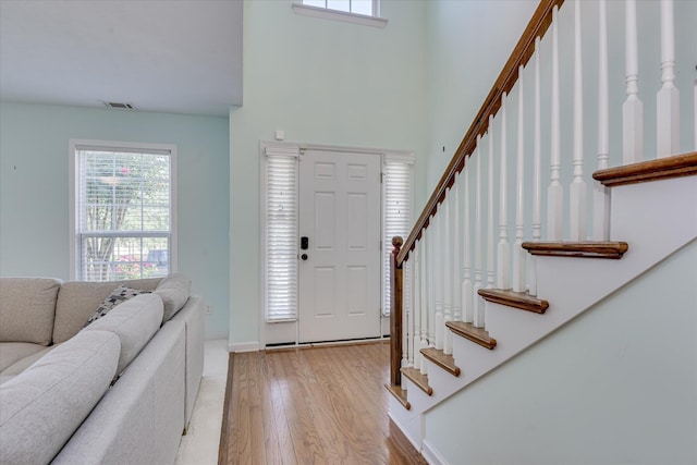 109 Mitchell Dr, North Augusta, SC 29860 - entryway featuring stairs, light wood-type flooring, healthy amount of natural light, and a high ceiling
