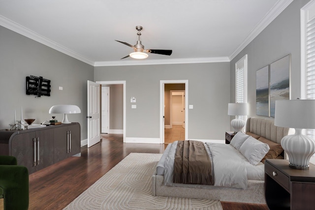 bedroom featuring crown molding, wood finished floors, baseboards, and ceiling fan