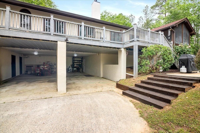 5114 Fairington Dr, Evans, GA 30809 - exterior space with stucco siding, a chimney, concrete driveway, and a deck