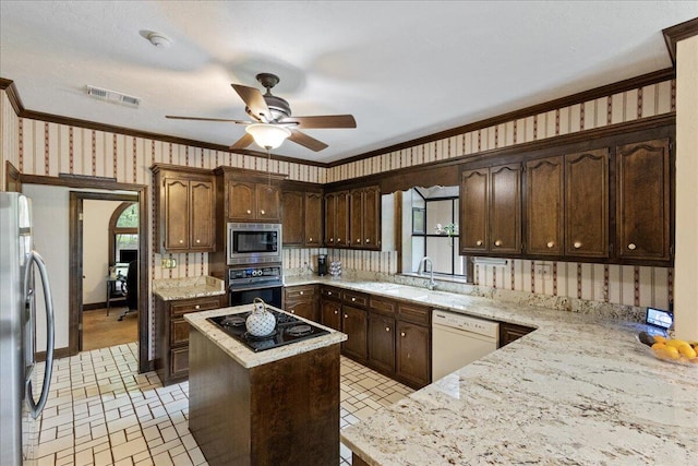 5114 Fairington Dr, Evans, GA 30809 - kitchen featuring a sink, visible vents, wallpapered walls, black appliances, and ornamental molding