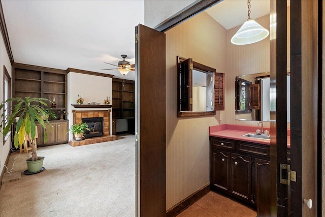 5114 Fairington Dr, Evans, GA 30809 - bathroom with a tiled fireplace, vanity, built in shelves, a ceiling fan, and baseboards
