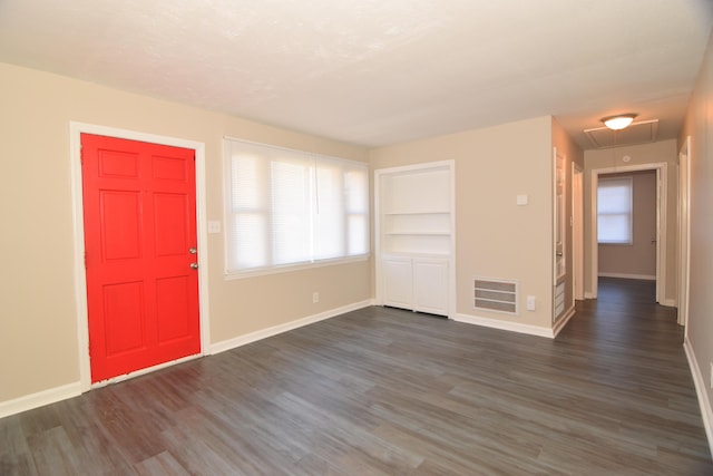 entryway with dark hardwood / wood-style flooring