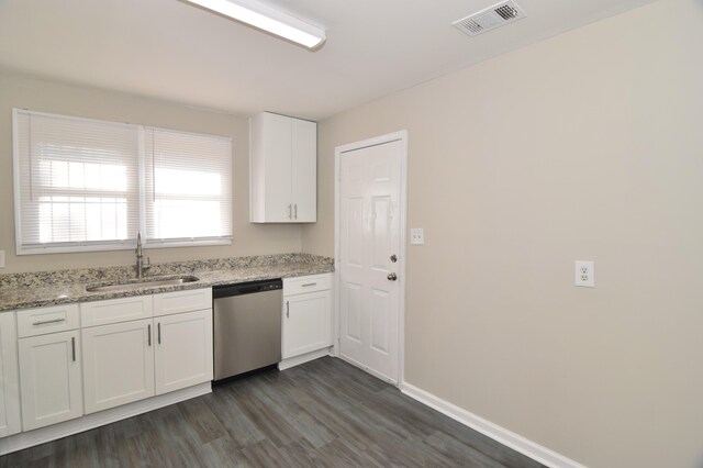 kitchen featuring dark hardwood / wood-style flooring, light stone counters, stainless steel dishwasher, sink, and white cabinetry