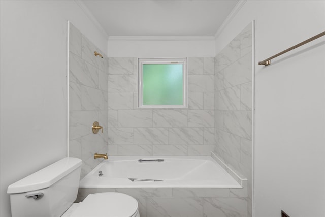 bathroom featuring tiled shower / bath combo, toilet, and crown molding