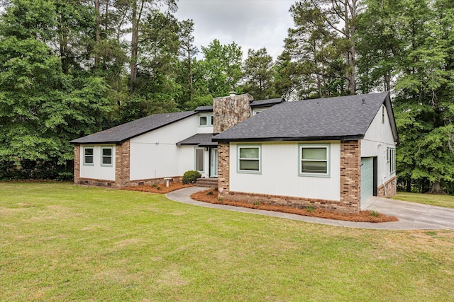 view of front facade with a garage and a front lawn