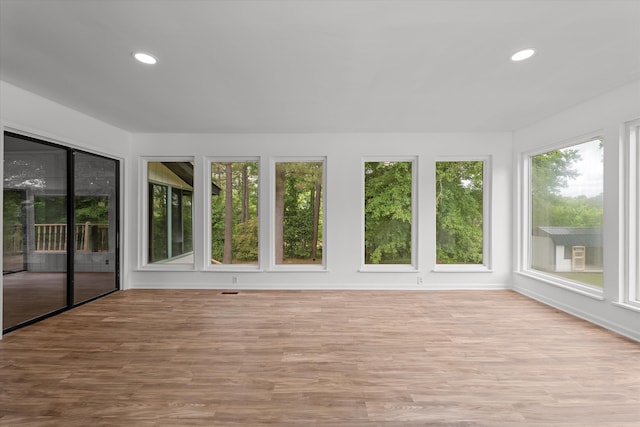 unfurnished sunroom featuring plenty of natural light