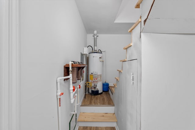 utility room featuring water heater