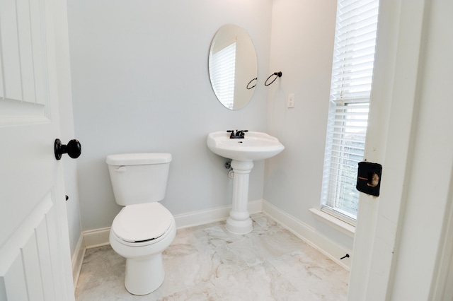 5553 Connor Dr, Evans, GA 30809 - half bath featuring toilet and marble look tile flooring