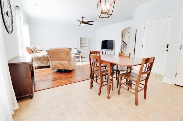 5553 Connor Dr, Evans, GA 30809 - dining area with arched walkways, a ceiling fan, ornamental molding, and a chandelier