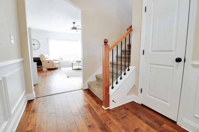 5553 Connor Dr, Evans, GA 30809 - staircase with a ceiling fan, wood-type flooring, and arched walkways