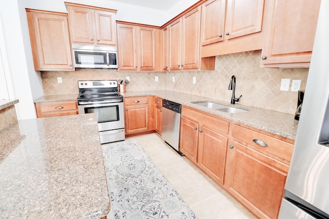 5553 Connor Dr, Evans, GA 30809 - kitchen with appliances with stainless steel finishes, light stone countertops, tasteful backsplash, ornamental molding, and light brown cabinets