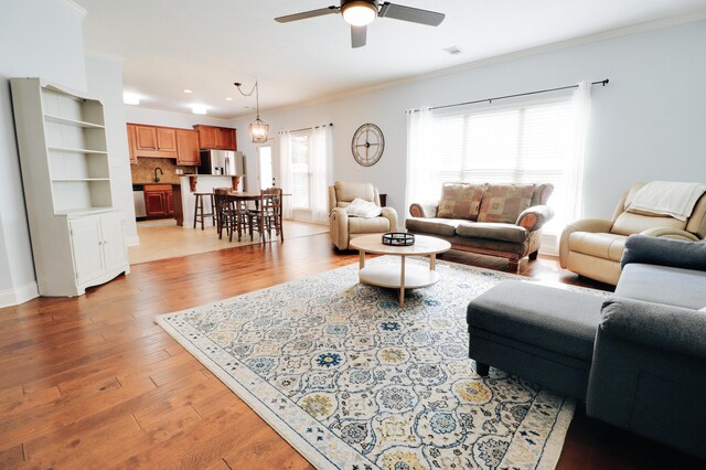 5553 Connor Dr, Evans, GA 30809 - living room with ornamental molding, ceiling fan, light wood-style flooring, and recessed lighting