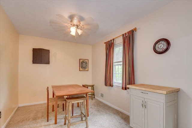 4056 Burning Tree Ln, Augusta, GA 30906 - dining area with a ceiling fan, light colored carpet, and baseboards