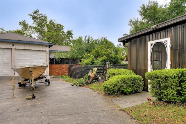4056 Burning Tree Ln, Augusta, GA 30906 - view of patio featuring fence, a garage, and an outbuilding