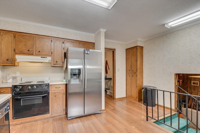 4056 Burning Tree Ln, Augusta, GA 30906 - kitchen with black appliances, under cabinet range hood, light wood-style flooring, light countertops, and a textured ceiling