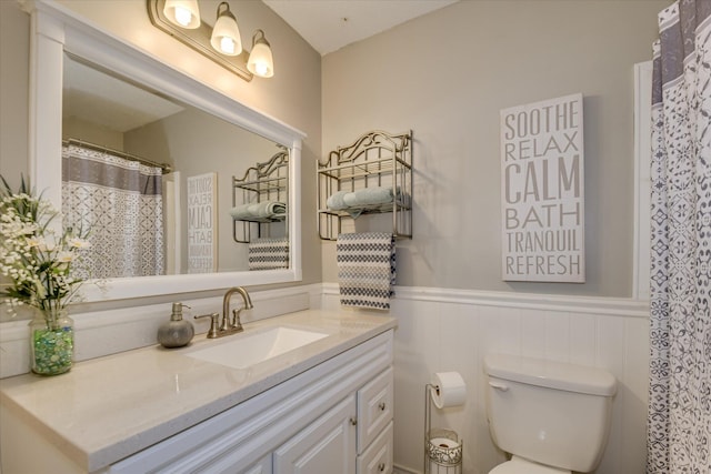 4056 Burning Tree Ln, Augusta, GA 30906 - bathroom featuring a wainscoted wall, toilet, and vanity