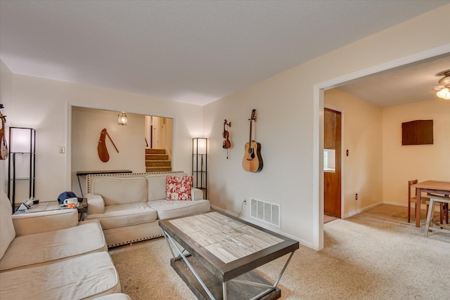 4056 Burning Tree Ln, Augusta, GA 30906 - living room featuring stairway, light colored carpet, and baseboards