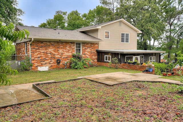4056 Burning Tree Ln, Augusta, GA 30906 - back of house with brick siding, a patio area, a sunroom, cooling unit, and a shingled roof