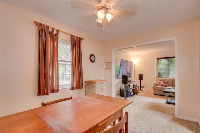 4056 Burning Tree Ln, Augusta, GA 30906 - dining space featuring a ceiling fan, plenty of natural light, light colored carpet, and baseboards