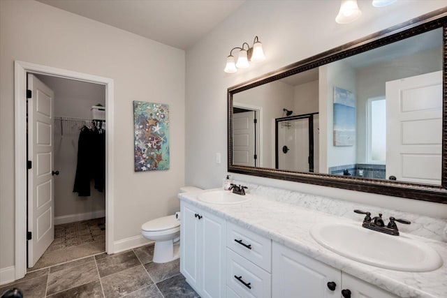 bathroom with vanity, toilet, and walk in shower