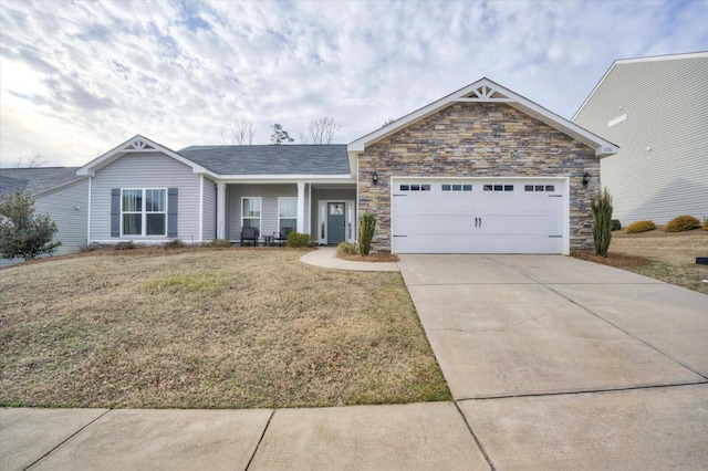 view of front of property featuring a garage and a front lawn