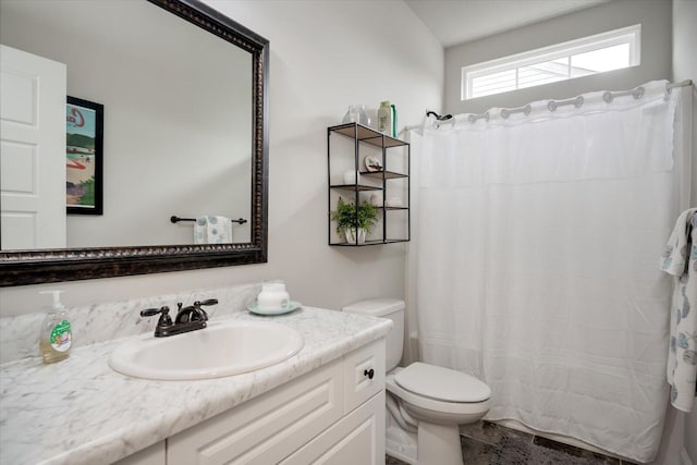 bathroom with vanity and toilet