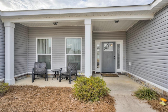 property entrance featuring covered porch