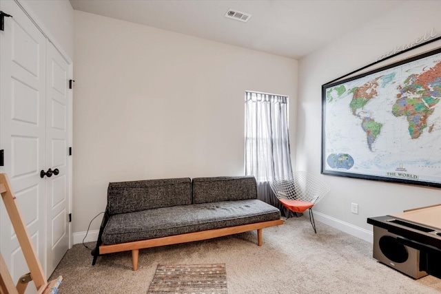 living area with light carpet