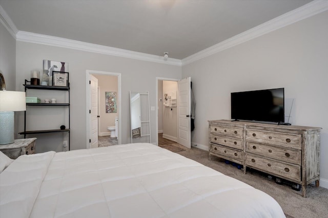 carpeted bedroom featuring connected bathroom and crown molding