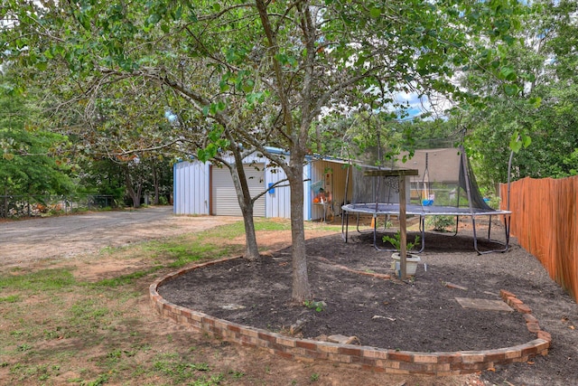 120 Stone St, Harlem, GA 30814 - view of yard featuring a trampoline and an outdoor structure