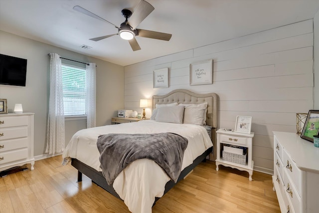 120 Stone St, Harlem, GA 30814 - bedroom featuring light wood finished floors, a ceiling fan, and wood walls