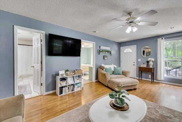 120 Stone St, Harlem, GA 30814 - living area featuring wood finished floors, a ceiling fan, and a textured ceiling