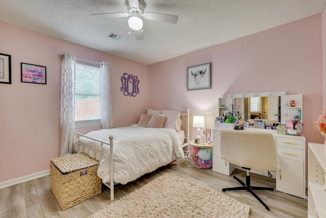 120 Stone St, Harlem, GA 30814 - bedroom featuring light wood-style flooring, a textured ceiling, and a ceiling fan