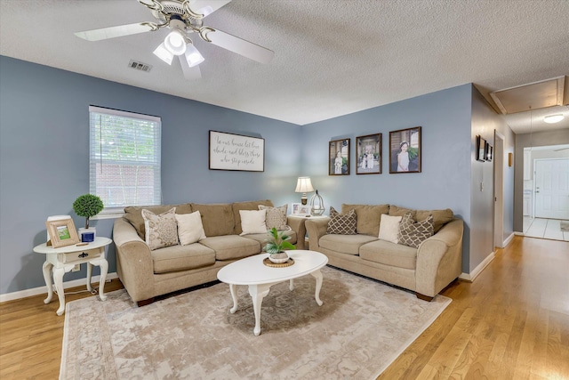 120 Stone St, Harlem, GA 30814 - living room with attic access, light wood finished floors, ceiling fan, and a textured ceiling