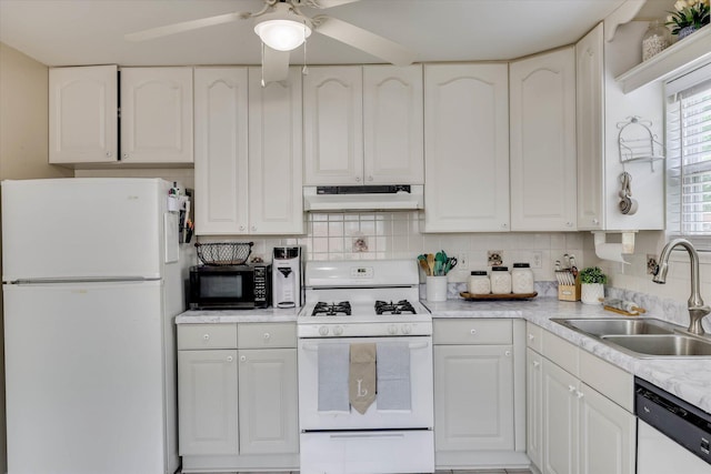 120 Stone St, Harlem, GA 30814 - kitchen with white appliances, under cabinet range hood, ceiling fan, white cabinets, and light countertops