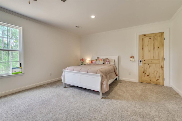 bedroom with carpet floors and ornamental molding