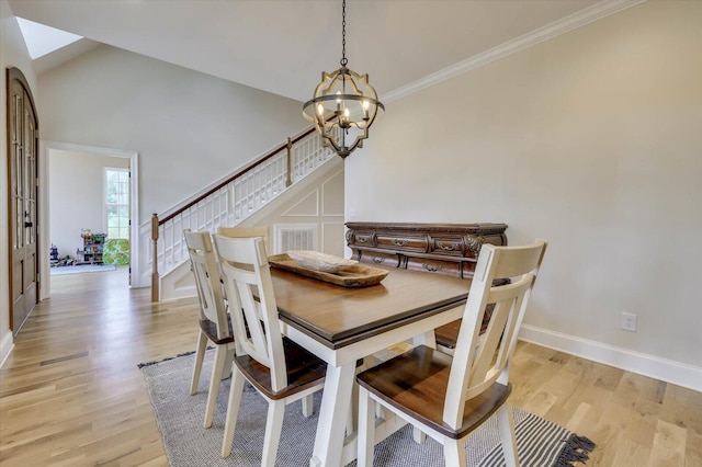 dining room featuring a notable chandelier and light hardwood / wood-style floors