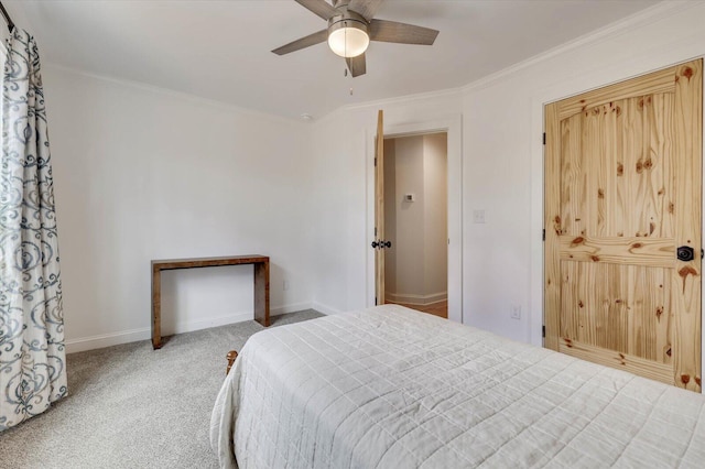 bedroom featuring carpet, ceiling fan, and ornamental molding