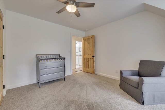 sitting room with ceiling fan and light colored carpet