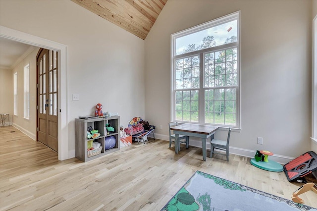 playroom featuring wood ceiling, light hardwood / wood-style floors, and vaulted ceiling