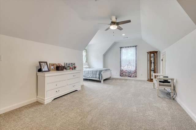 carpeted bedroom with vaulted ceiling and ceiling fan