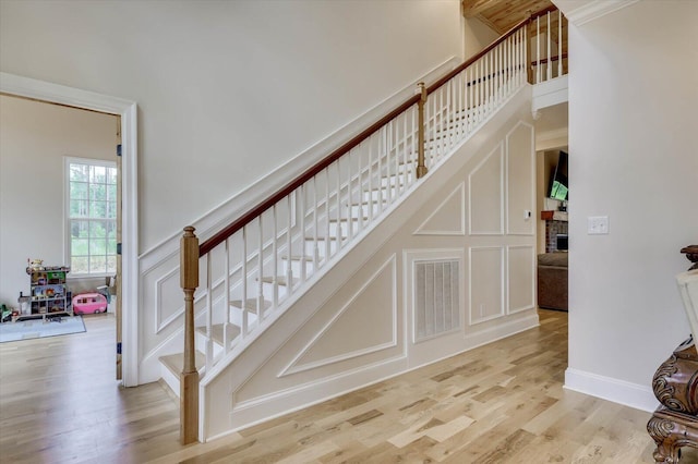 staircase with wood-type flooring