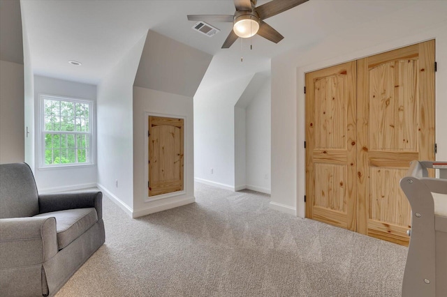 unfurnished room with ceiling fan and light colored carpet