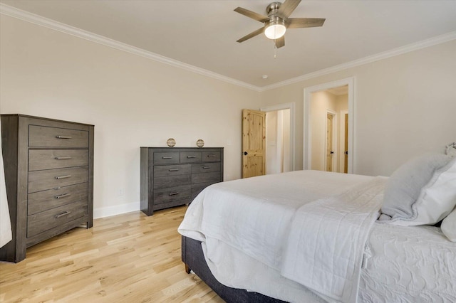 bedroom featuring ceiling fan, light hardwood / wood-style floors, and ornamental molding