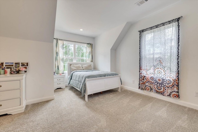 bedroom with light colored carpet