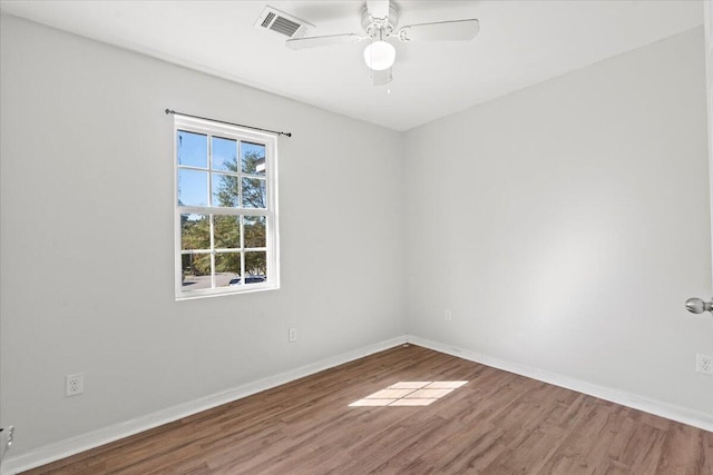 unfurnished room featuring hardwood / wood-style floors and ceiling fan