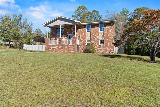 view of front of house featuring a carport, a porch, and a front yard